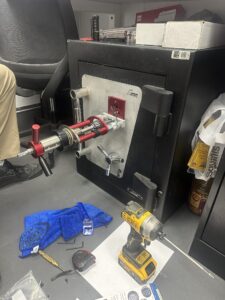 Safe opening in progress with locksmith tools and drill inside a Tempe, AZ restaurant — Arizona Mobile Locksmith